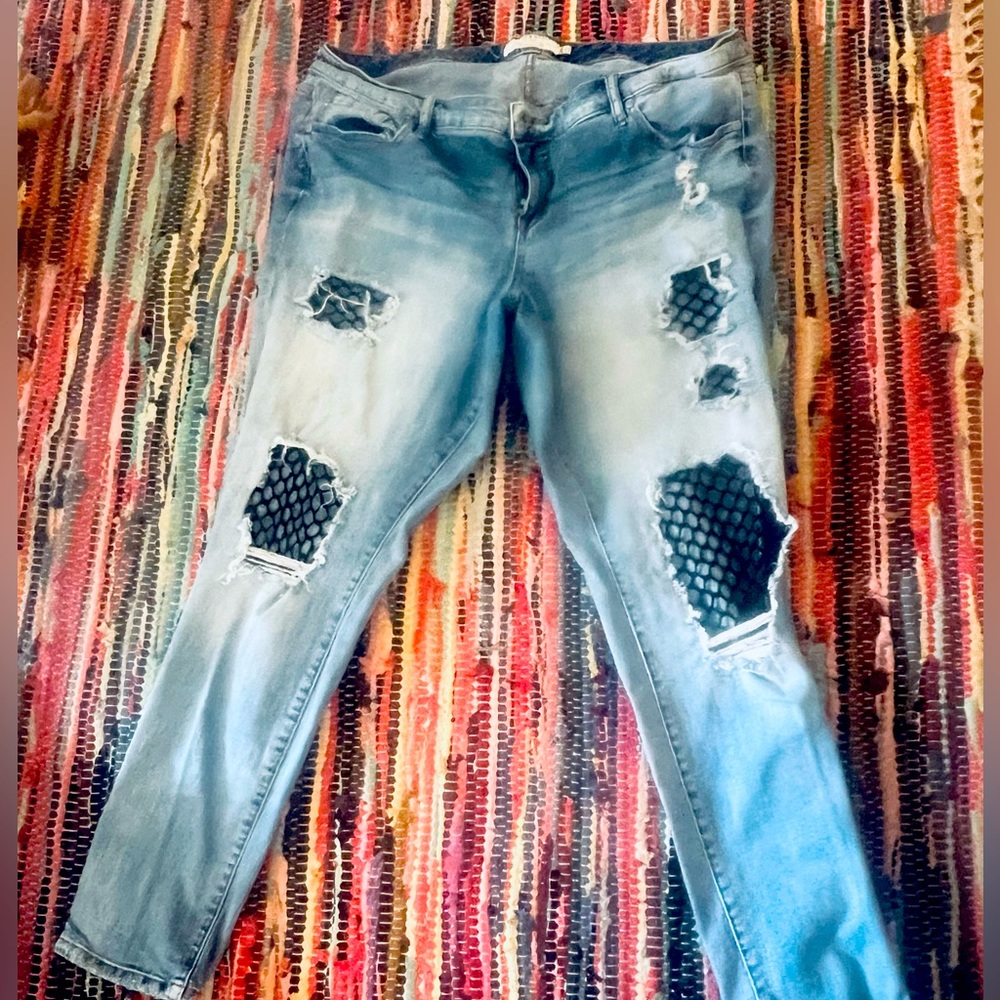 Plus size mid rise torrid jeans with fishnet detail